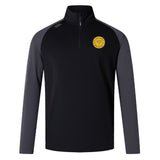 The EMB Canterbury West Chester University Elite First Layer is a black and dark gray long-sleeve pullover with quarter-zip, VapoDri tech, and a yellow circular chest emblem—ideal as a rugby training top.