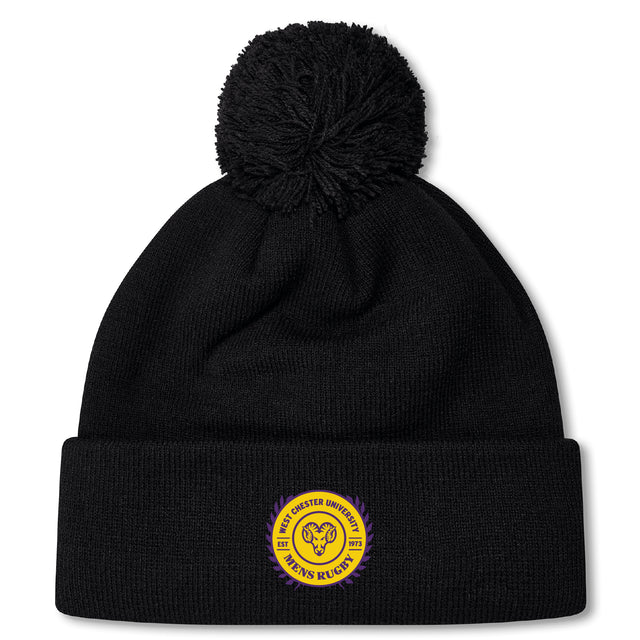 The West Chester University Pom Pom Beanie by EMB Canterbury is a black hat with a pom-pom, featuring a yellow and purple circular "West Chester University" patch on the front and a cozy fleece-lined interior for extra warmth.