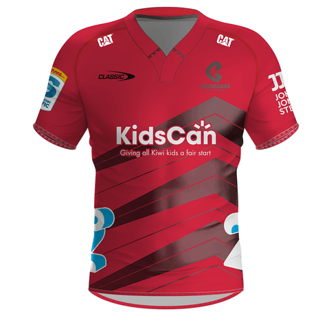 The Crusaders Super Rugby Home Jersey 24 by Classic Sportswear, from the Canterbury region jersey collection, features several logos including "KidsCan," "Caterpillar," and "Classic." Diagonal black stripes and other sponsor names enhance the sleeves.