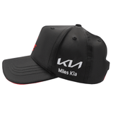 The Crusaders Super Rugby Media Cap 25/26 by Classic Sportswear is a sleek black baseball cap made from quick-drying polyester, featuring red and white embroidered "Miles Kia" branding on the sides and front, along with a distinctive logo.