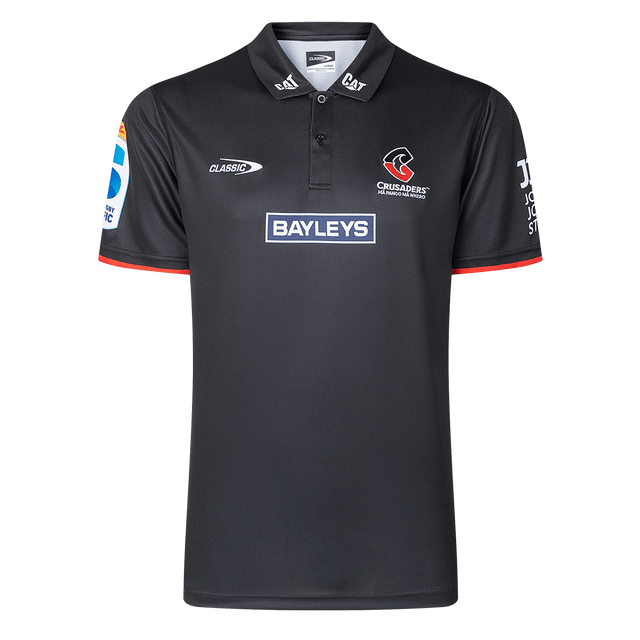 The Crusaders Super Rugby Team Polo 25/26 by Classic Sportswear, made from moisture-wicking fabric, showcases embroidered Bayleys and Crusaders logos on the front and sleeves.