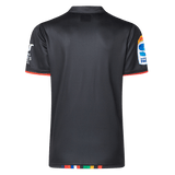 The back view of the Crusaders Super Rugby Team Polo 25/26 by Classic Sportswear highlights a black sports jersey made from moisture-wicking fabric, with colorful trim on the hem and sleeves, and embroidered sponsor logos.