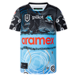 The Sharks Indigenous NRL 25/26 Replica Jersey by Classic Sportswear features Indigenous-inspired black, blue, and white patterns, with "Aramex" and "Pilot" sponsor logos on the front and the Sharks team logo on the chest.