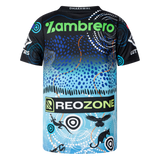 The Sharks Indigenous NRL 25/26 Replica Jersey by Classic Sportswear features blue Indigenous-inspired patterns, animal silhouettes, and the "Zambrero," "REOZONE," and "DHARAWAL" logos.