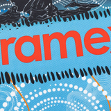 Close-up of a blue textured surface from the Sharks Indigenous NRL 25/26 Replica Jersey by Classic Sportswear, featuring aboriginal-style white dot patterns and partial red "ramex" text.