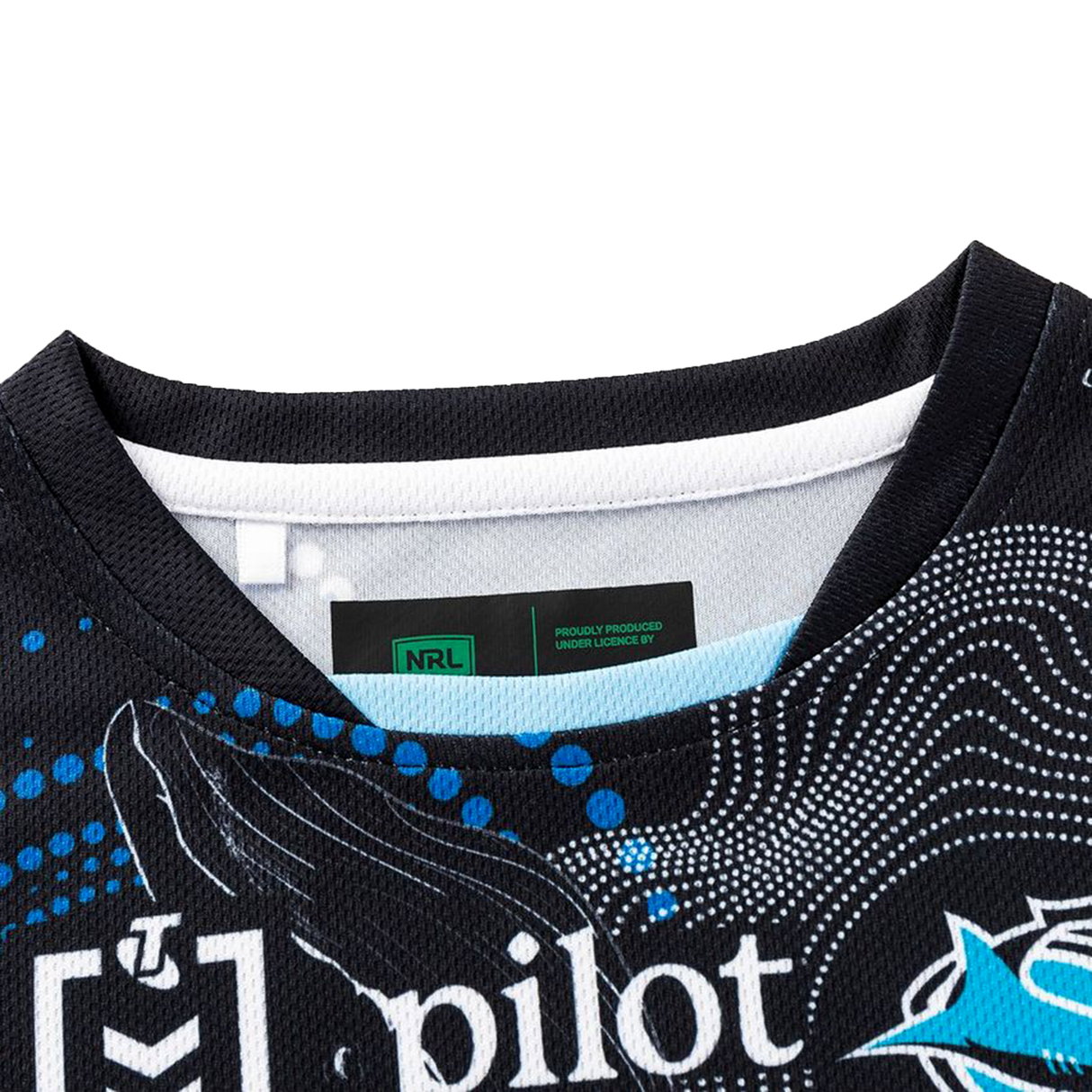 Close-up of the collar and label of the Sharks Indigenous NRL 25/26 Replica Jersey by Classic Sportswear, highlighting white and blue graphics plus an inside NRL logo tag—an authentic replica rugby design.