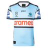 The Sharks NRL 26/27 Replica Home Jersey by Classic Sportswear is light blue with black, white, and blue stripes, featuring the Cronulla Sharks logo, NRL Premiership logo, and "aramex" sponsor across the chest.