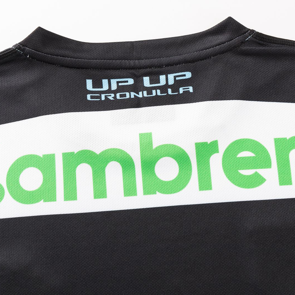 Close-up of the back of the Sharks NRL 26/27 Replica Home Jersey by Classic Sportswear, showing “UP UP CRONULLA” in white and blue above part of a green logo.