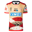 The Dolphins Indigenous NRL 25/26 Replica Jersey by Classic Sportswear features gold, red, black, and white patterns, multiple sponsor logos, and a dolphin emblem for a stylish display of team pride.