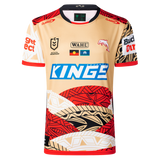 The Dolphins Indigenous NRL 25/26 Replica Jersey by Classic Sportswear features gold, red, black, and white patterns, multiple sponsor logos, and a dolphin emblem for a stylish display of team pride.