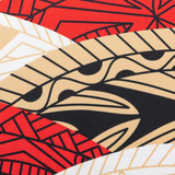 A close-up of fabric with bold, abstract geometric patterns in red, black, beige, and white—featured on the Dolphins Indigenous NRL 25/26 Replica Jersey by Classic Sportswear.
