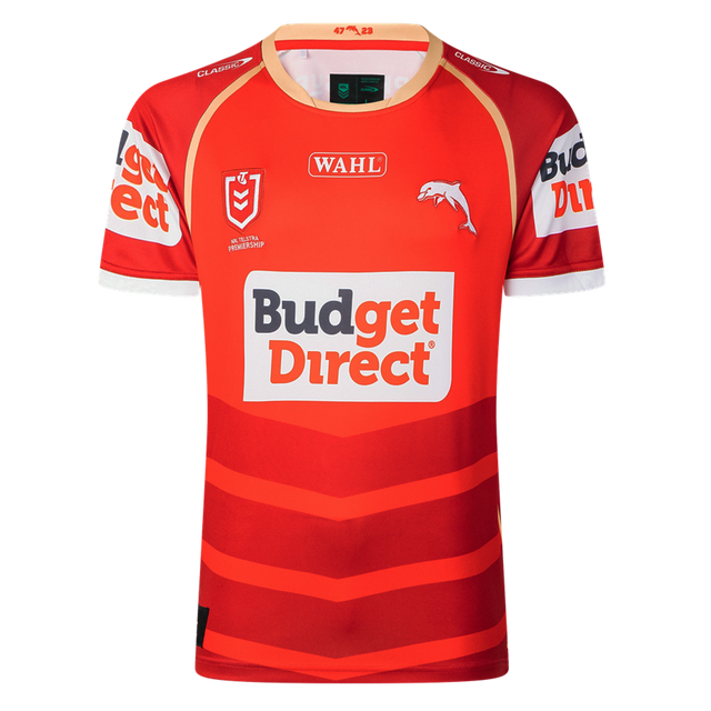 Show your support on game day with the Dolphins NRL 26/27 Replica Home Jersey by Classic Sportswear, featuring red fabric with white and orange accents, "Budget Direct" main sponsor logo, and authentic details.