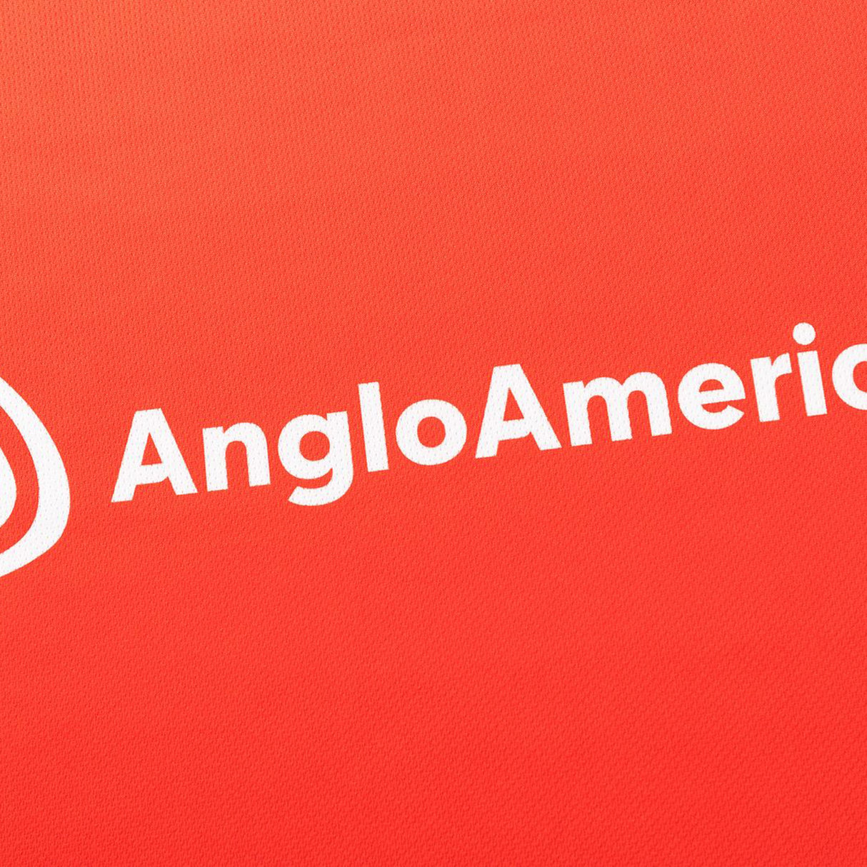 White "AngloAmerican" text and a white logo appear on a red background, matching the style of the Dolphins NRL 26/27 Replica Home Jersey by Classic Sportswear.
