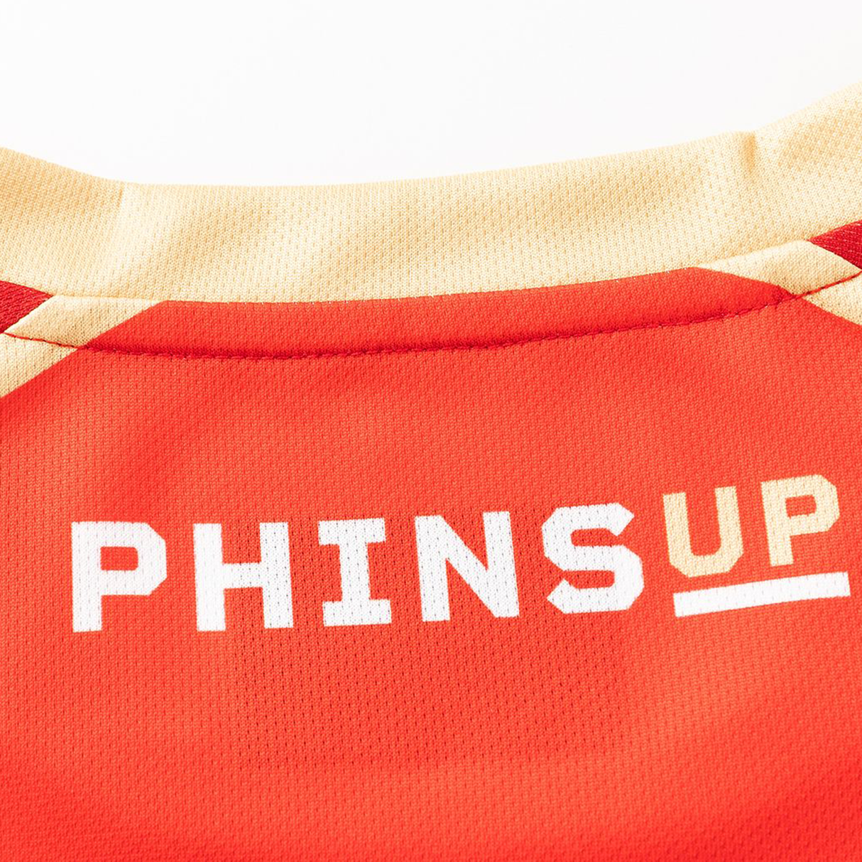Close-up of the Dolphins NRL 26/27 Replica Home Jersey by Classic Sportswear, showing “PHINS UP” in white and gold on the back near the collar—a signature detail of this authentic replica.
