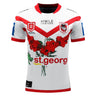 A white rugby jersey with red accents featuring the St George Illawarra Dragons logo, a red flower design, a green dragon graphic, and sponsor logos. This Dragons NRL Heritage Jersey by Classic Sportswear is part of the Official NRL Merchandise for the St. George-Illawarra Dragons 2023 season.