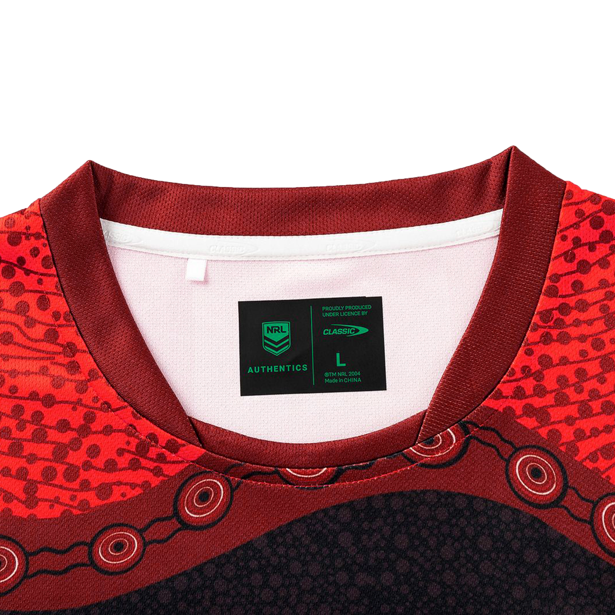 Close-up of the collar and neckline on the Dragons Indigenous NRL 25/26 Replica Jersey by Classic Sportswear, highlighting an NRL Authentics tag with size L.