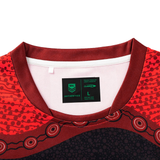 Close-up of the collar and neckline on the Dragons Indigenous NRL 25/26 Replica Jersey by Classic Sportswear, highlighting an NRL Authentics tag with size L.
