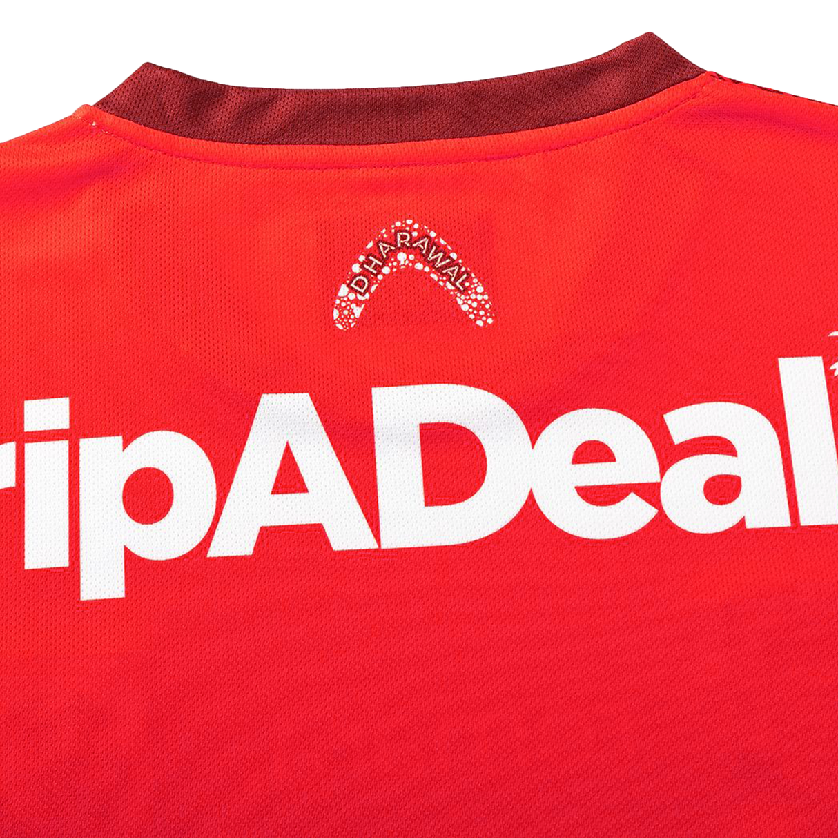 Close-up of the Dragons Indigenous NRL 25/26 Replica Jersey by Classic Sportswear, displaying a red design with white "TripADeal" and small "Alofa Rawali" logos near the collar.