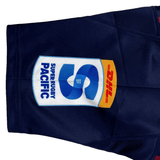 Blue sports shorts with the Highlanders Super Rugby Heritage Jersey by Classic Sportswear logo and a dhl sponsor logo on the leg, paired with a Highlanders Rugby Jersey.