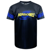 Black sports jersey with "HURRICANES" in yellow text and a blue swirl graphic on the front, featuring blue bands on the sleeves. Perfect for showing your support, this Classic Sportswear Hurricanes Super Rugby Supporters Tee 24 proudly displays the Hurricanes logo.