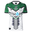 The NRL Maori All Stars 25/26 Replica Home Jersey by Classic Sportswear features a striking green and white Māori-inspired design. Adorned with logos and "TEACH ME ABOUT PROPERTY" text, it uses anti-microbial wickable fabric to display vibrant, lasting sublimated graphics.