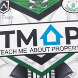 Close-up of the NRL Maori All Stars 25/26 Replica Home Jersey by Classic Sportswear featuring sublimated graphics with the text "Teach Me About Property" next to a blue house symbol.
