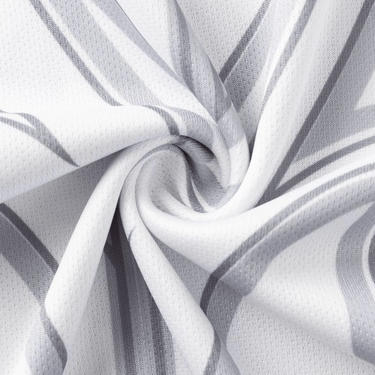 Close-up of a Classic Sportswear NRL Maori All Stars 25/26 Replica Home Jersey, featuring textured white and gray fabric with a swirl pattern, showcasing sublimated graphics and intersecting lines.