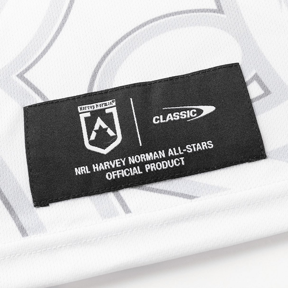 Black and white fabric label featuring "NRL Maori All Stars Official Product" and logos for "Classic Sportswear" with sublimated graphics on the NRL Maori All Stars 25/26 Replica Home Jersey by Classic Sportswear.