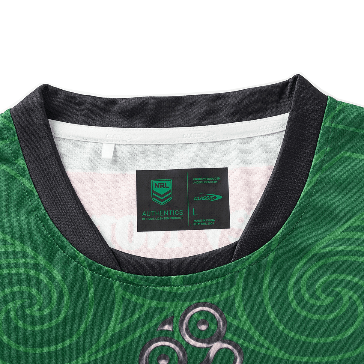 The NRL Maori All Stars 25/26 Replica Home Jersey by Classic Sportswear is a green sports jersey with sublimated swirling patterns, a visible neck tag for size L and brand details, and features anti-microbial wickable fabric for enhanced comfort.
