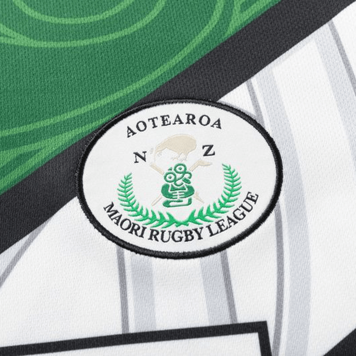 The NRL Maori All Stars 25/26 Replica Home Jersey by Classic Sportswear features the Aotearoa NZ Maori Rugby League logo elegantly displayed on its sublimated white and green graphic design.