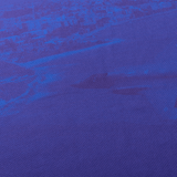 Close-up of a blue textured fabric with a subtle darker blue pattern, reminiscent of the Knights NRL Heritage Jersey by Classic Sportswear.