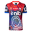 The Knights Indigenous NRL 25/26 Replica Jersey by Classic Sportswear features striking red, blue, and white patterns, sponsor logos, and cultural artwork on the front—celebrating team heritage and pride.