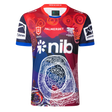 The Knights Indigenous NRL 25/26 Replica Jersey by Classic Sportswear features striking red, blue, and white patterns, sponsor logos, and cultural artwork on the front—celebrating team heritage and pride.