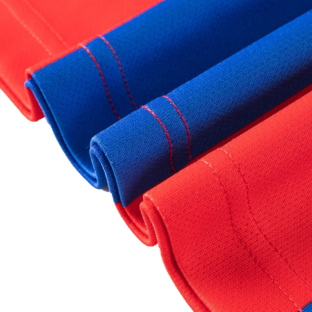 Close-up of red and blue fabric with visible stitching, rolled together—echoing the vibrant colors of the Knights NRL 26/27 Replica Home Jersey by Classic Sportswear.