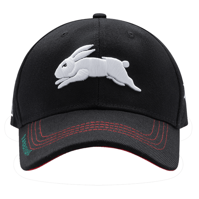 The Rabbitohs NRL 25/26 Media Cap by Classic Sportswear is a black quick-drying polyester baseball cap featuring an embroidered white rabbit on the front and red stitching accents on the brim, showcasing stylish branding.