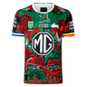 The Rabbitohs Indigenous NRL 25/26 Replica Jersey by Classic Sportswear features Aboriginal-inspired red, green, and black designs, sponsor logos including a large "MG," and is the official Rabbitohs NRL jersey.