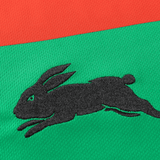 Classic Sportswear's Rabbitohs NRL 25/26 Replica Home Jersey showcases a sleek black rabbit logo on a vibrant green and red background.