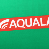 A green background with a red diagonal stripe showcases "AQUALAND" in bold white letters, echoing the style of the Rabbitohs NRL 25/26 Replica Home Jersey by Classic Sportswear.
