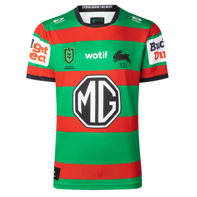 The Rabbitohs NRL 26/27 Replica Home Jersey by Classic Sportswear features red and green stripes, sponsor logos (MG, wotif, Budget Direct), and a black rabbit emblem—an authentic South Sydney home jersey.