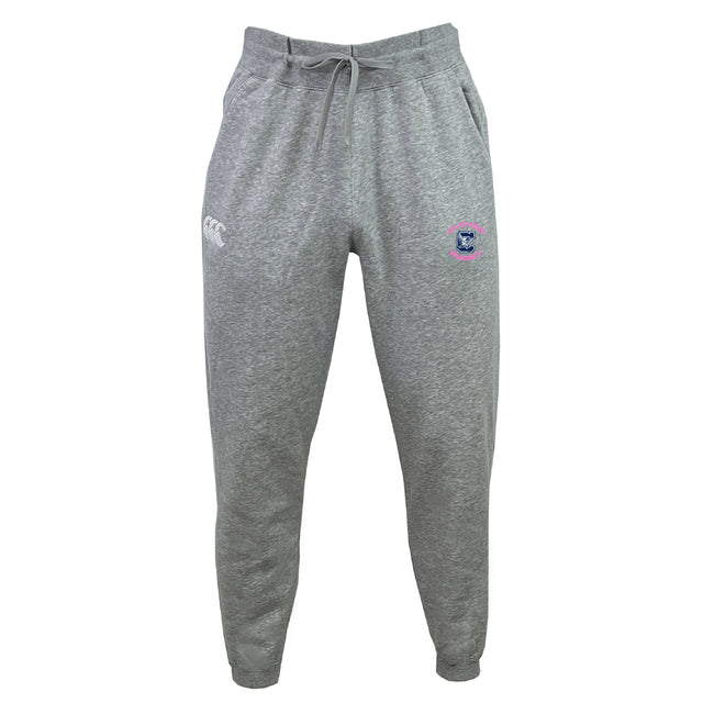The Clover Middle Girls Leisure Sweatpant by EMB Canterbury features a drawstring waistband, white logo on the left thigh, and a colorful emblem on the right thigh, crafted for comfort and style. Displayed against a plain white background.