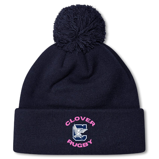 Stay warm in the Clover Middle Girls Pom Pom Beanie by EMB Canterbury—a navy blue knit hat with a pom-pom, "CLOVER RUGBY," a large "C" and clover logo on the front, plus cozy fleece lining for extra comfort.