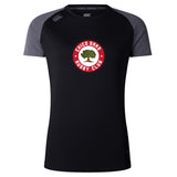The Chico Oaks Women's Elite Training Tee by WRS Canterbury features dark gray sleeves and Vapodri technology. Made from lightweight fabric, it sports a central tree logo for the "Chico Oaks Rugby Club," blending performance and style seamlessly.