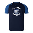 The Clover Middle School Elite Training Tee by WRS Canterbury features navy and blue short sleeves, "Clover Rugby" text with a bird chest graphic, and is made from lightweight, durable Vapodri fabric for top comfort and performance.