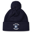 The Clover Middle School Pom Pom Beanie by EMB Canterbury is a navy blue knit hat with a pom-pom and features a "CLOVER RUGBY" logo with a large C and horse’s head on the front cuff.