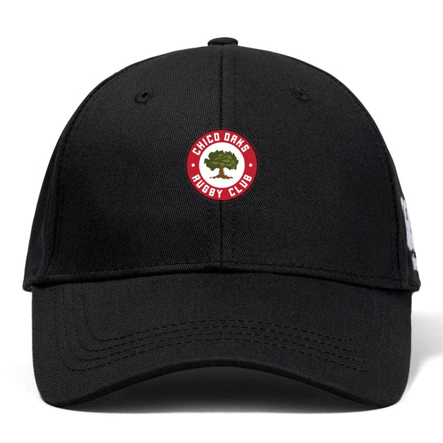 The Chico Oaks Flexfit Drill Cap by Canterbury, from EMB Canterbury, features a curved brim and the iconic red and white "Chico Oaks Rugby Club" logo on the front, combining style with comfort.