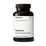 Momentous Calcium is a dietary supplement in a black bottle labeled "Calcium Foundational & Bone Health," containing 60 capsules of absorbable calcium to support bone strength.