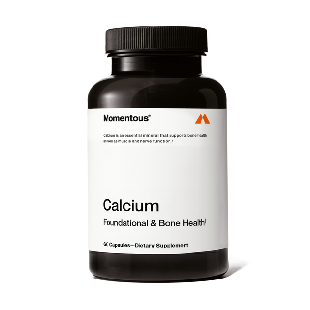 Momentous Calcium is a dietary supplement in a black bottle labeled "Calcium Foundational & Bone Health," containing 60 capsules of absorbable calcium to support bone strength.