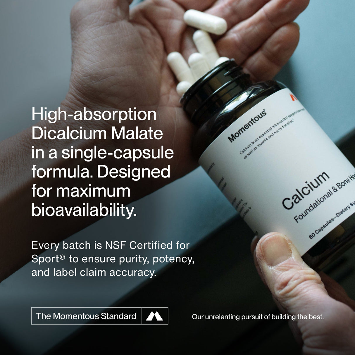 A hand holds a bottle of Momentous Calcium, while another hand takes out capsules. Product details and certifications appear on the left, emphasizing calcium’s role in supporting bone strength.