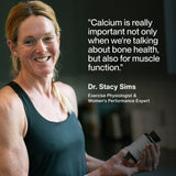 A woman in workout attire smiles, holding a bottle of Momentous Calcium. Beside her, a quote about the importance of calcium for bone and muscle health is featured, attributed to Dr. Stacy Sims.