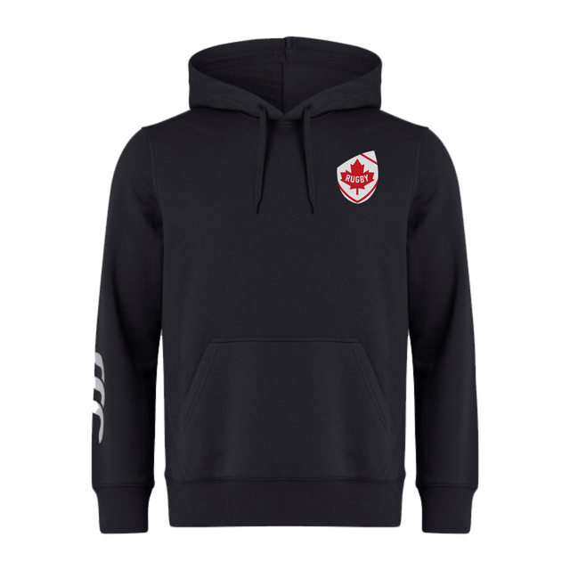 The EMB Canterbury Canada Shield Club Hoodie is black, featuring a drawstring hood, embroidered red shield logo on the chest, and a white design on the left sleeve. Crafted from premium sweatshirt fleece for superior comfort and style.